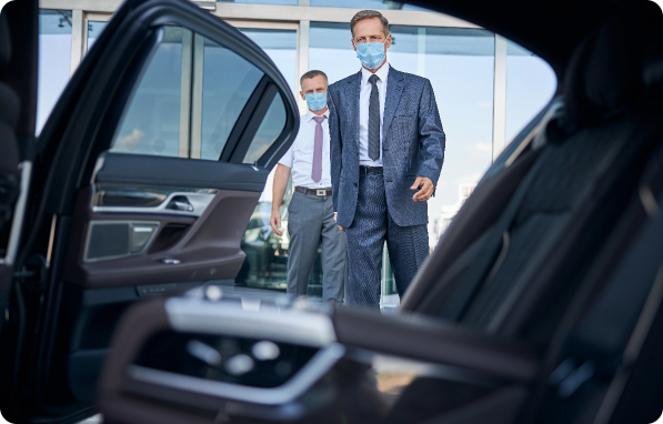 businessman with driver leaving airport in car dur 2024 10 19 19 58 34 utc